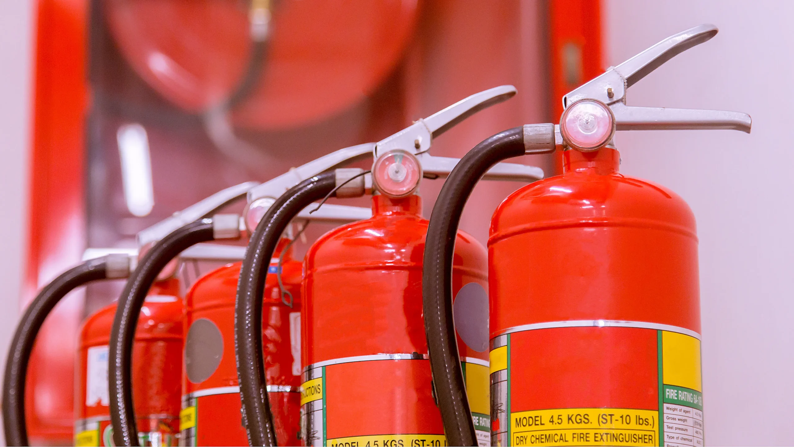 Red tank of fire extinguisher Overview of a powerful industrial fire extinguishing system Red tank of fire extinguisher Overview of a powerful industrial fire extinguishing system